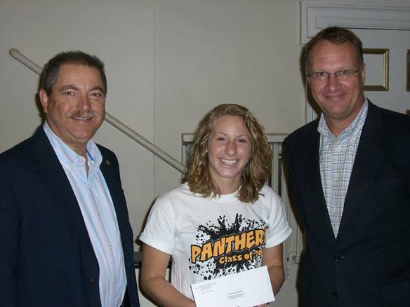 Paul Tward and Blair Mathies present scholarship check