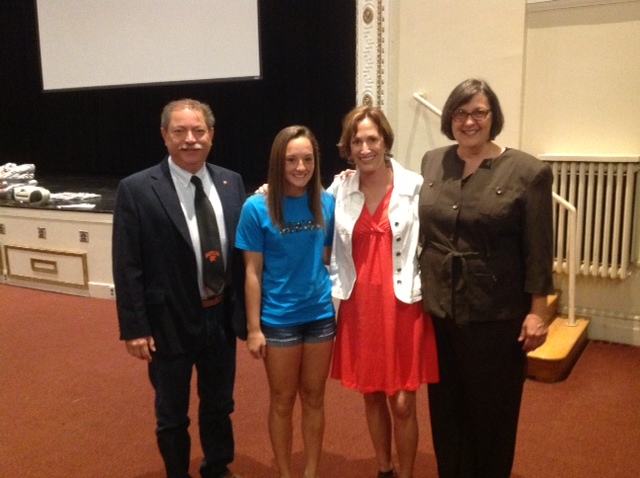 Paul Twardy, Giffy Walbridge Foltz, and Kathy Harris present scholarship check
